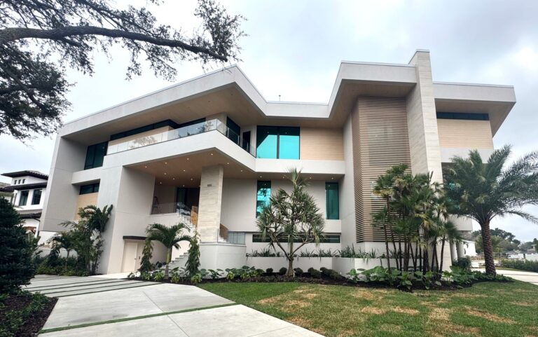 Contemporary luxury home with palm trees