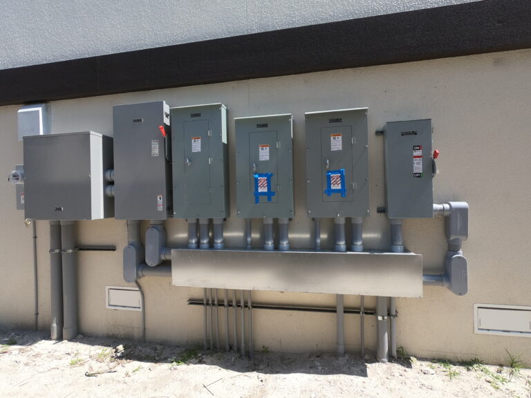 Exterior electrical panels and conduit on wall