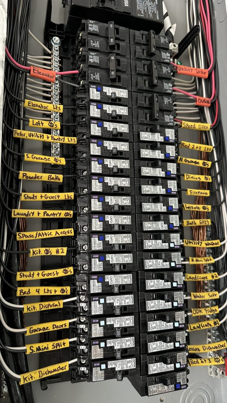 Residential breaker panel with yellow circuit labels